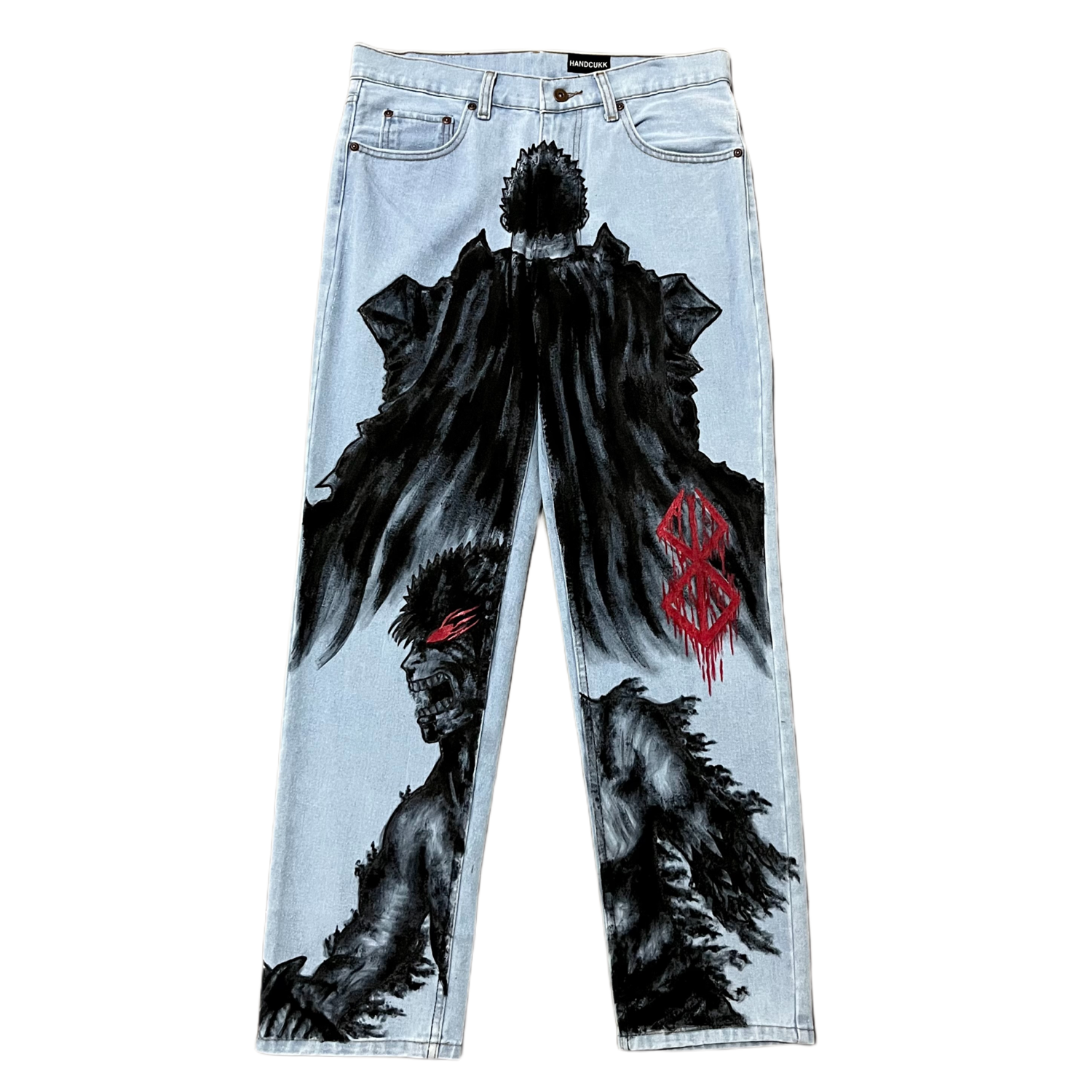 Light blue jeans with black and red graphic designs on a white background