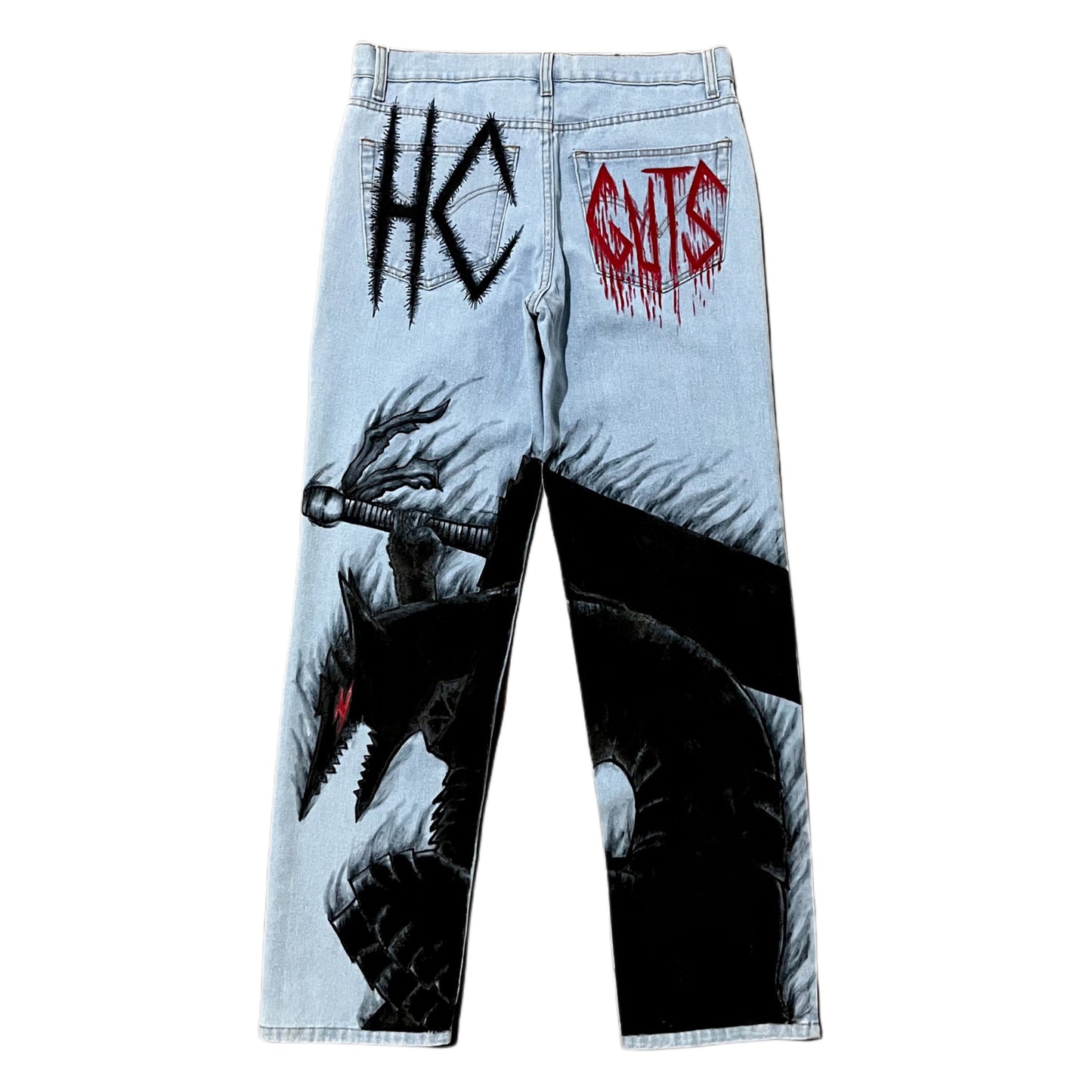 Light blue jeans with a dragon graphic and 'HC' and 'Guts' text on a white background
